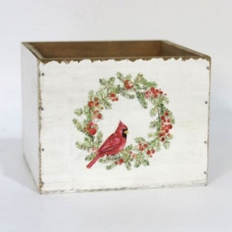 Aspect vieilli avec un cardinal dans une boîte décorative à couronne
