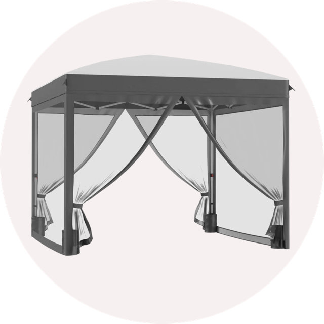Dark gray pop-up gazebo with sheer white curtains pulled to the sides against a circular background.