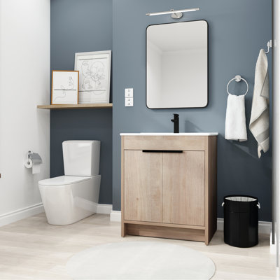 Meuble-lavabo élégant avec lavabo en céramique et portes à fermeture douce, un ajout fonctionnel et élégant à votre salle de bain.
