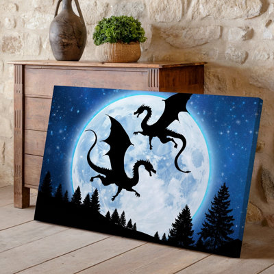 Toile, scène mystique de nuit mettant en vedette deux dragons silhouettes en vol contre une art mural