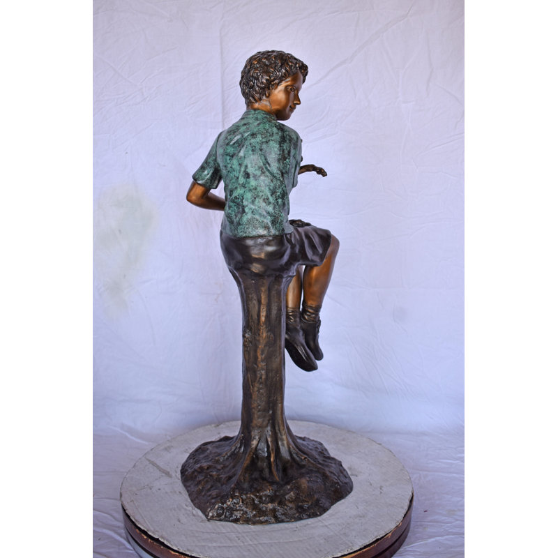 Boy Sitting On A Log With His Puppy Bronze Statue - Size: 15"L X 15"W X 35"H.