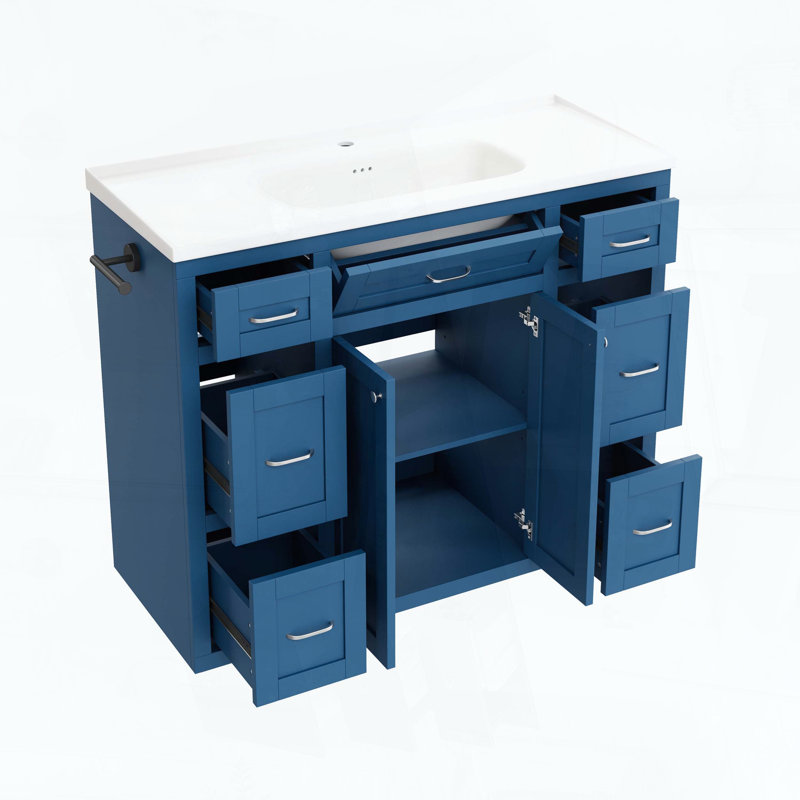 Meuble-lavabo sur pied avec lavabo en céramique, six tiroirs, tiroir central rabattable, portes doubles à fermeture amortie et porte-serviettes réversible, bleu marine