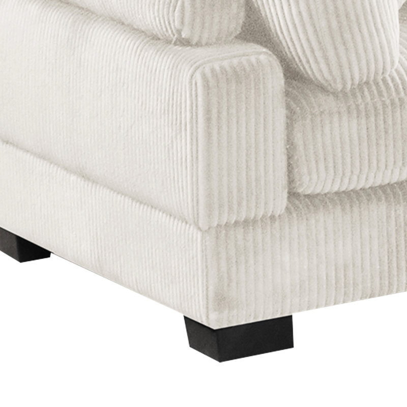 Coussin de coin moderne en velours côtelé crème, soutenu par des pieds, coin détente recouvert de velours côtelé, look contemporain, note moyenne