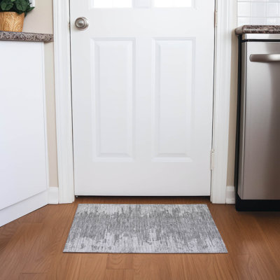 Tapis intérieur / extérieur rectangulaire avec envers antidérapant Emblyn