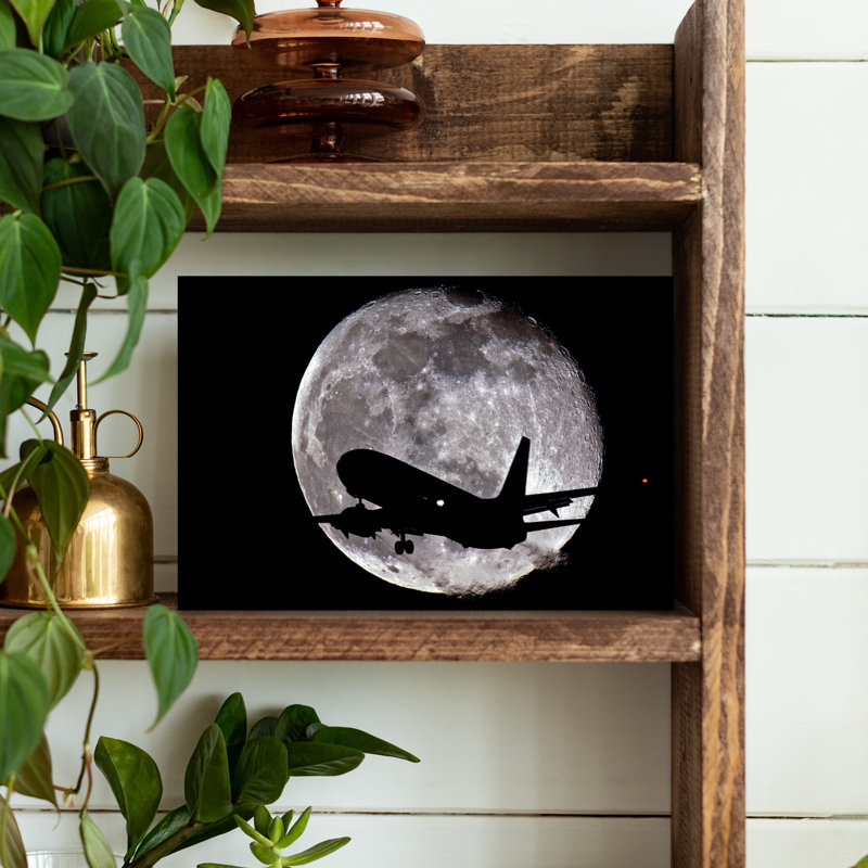 Jet In Silhouette In Front Of The Moon by Vito Palmisano - Wrapped Canvas Print, 30.48cm H x 45.72cm W