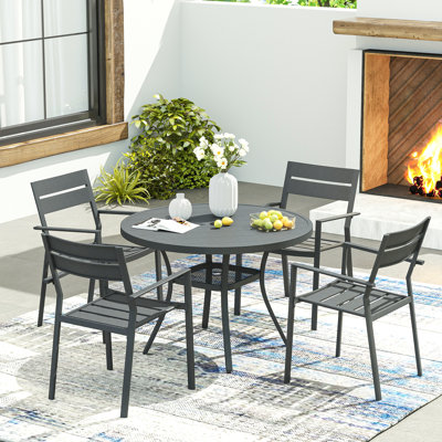 Eidanas Round 4 - Person 41.7'' L Outdoor Dining Set with 4 Stackable Chairs