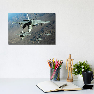 Four US Navy F/A-18 Hornet Aircraft Fly Over Mountains In Afghanistan by Stocktrek Images - Wrapped Canvas Print