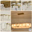 Lustre linéaire doré à 14 ampoules Radiant Gold - réglable en hauteur, prêt pour le plafond incliné