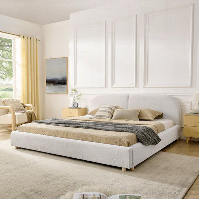 Structure de lit rembourrée de style minimaliste moderne avec une grande tête de lit courbée