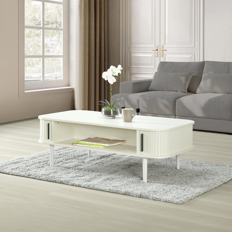 Aguilera 47.2" W Mid Century Coffee Table with Storage and Fluted Sliding Door, White Oak