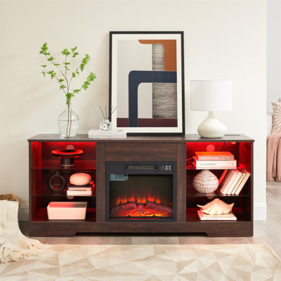 Ce meuble télé moderne avec foyer électrique, lumières DEL, tablettes en verre et charge USB peut accueillir un téléviseur de 62 po ou moins, alliant style et fonctionnalité.