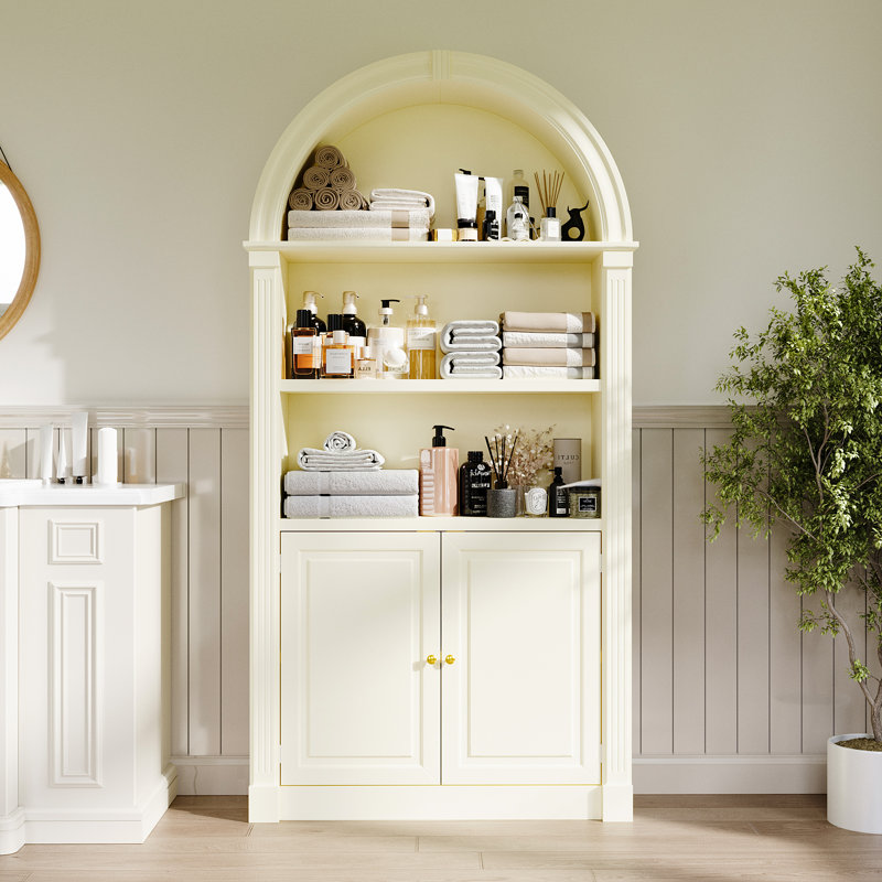 Élégante armoire de salle de bain à deux portes avec dessus en arche et trois tablettes ouvertes