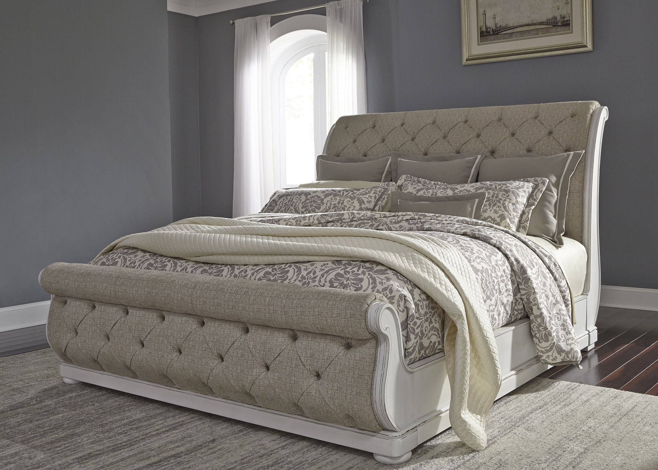 Upholstered tufted deals sleigh bed