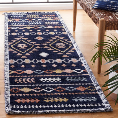 Baston Southwestern Navy/Orange/White Area Rug