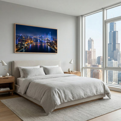 Illuminated City Skyline Over River At Night With Bridges Canvas Wall Art