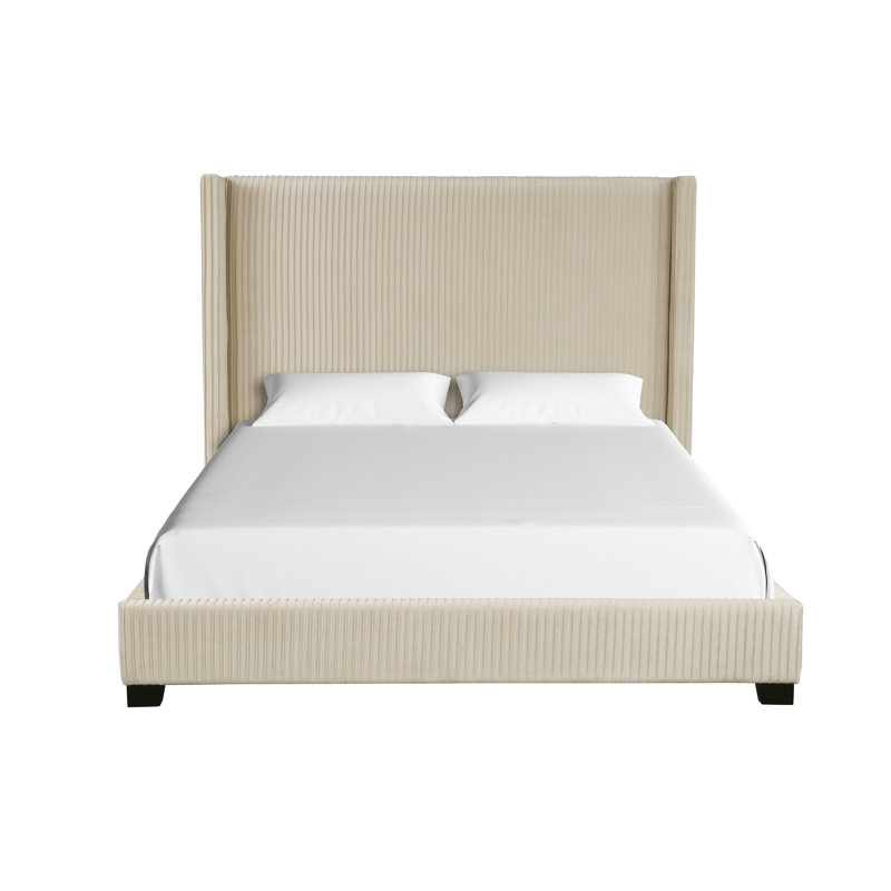 Grand lit tapissier dans une boîte beige