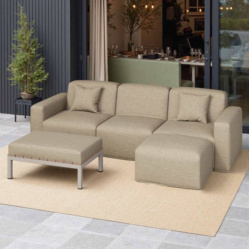 Ensemble de patio modulaire Tomczyk Ultimate modulaire de 5 pièces, comprenant 2 fauteuils, une chaise sans accoudoirs, un pouf et une table basse. Tissu résistant aux intempéries et aux UV. Aucun assemblage requis.