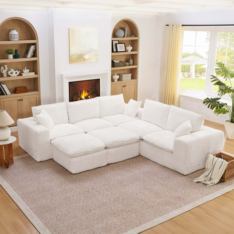 Canapé modulaire moderne en L avec repose-pieds mobiles et confort Cloud