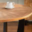 Table de salle à manger ronde de style rétro avec motif d'épissures