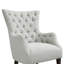 Fauteuil à oreilles capitonné