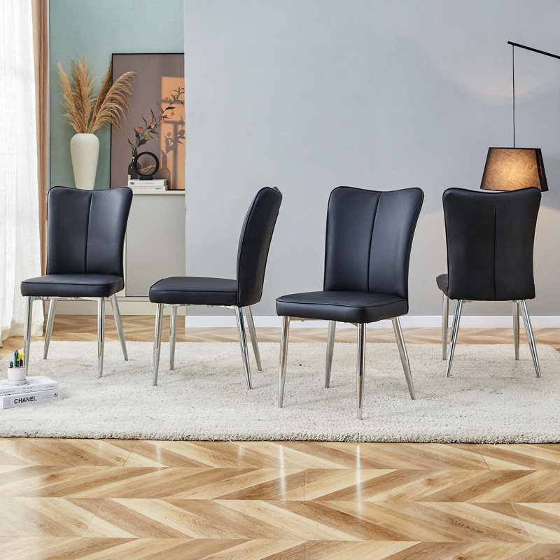 Chaises de salle à manger modernes et minimalistes en cuir synthétique avec dossier incurvé et coussins de siège, pieds de chaise en métal galvanisé