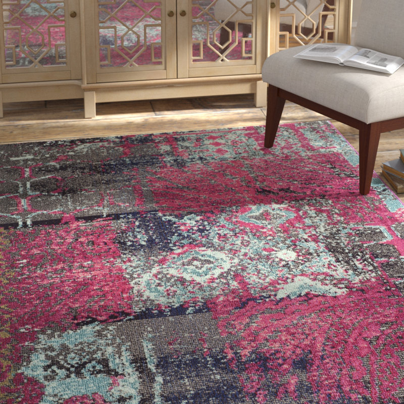 Tapis rose à motif abstrait Hertzler