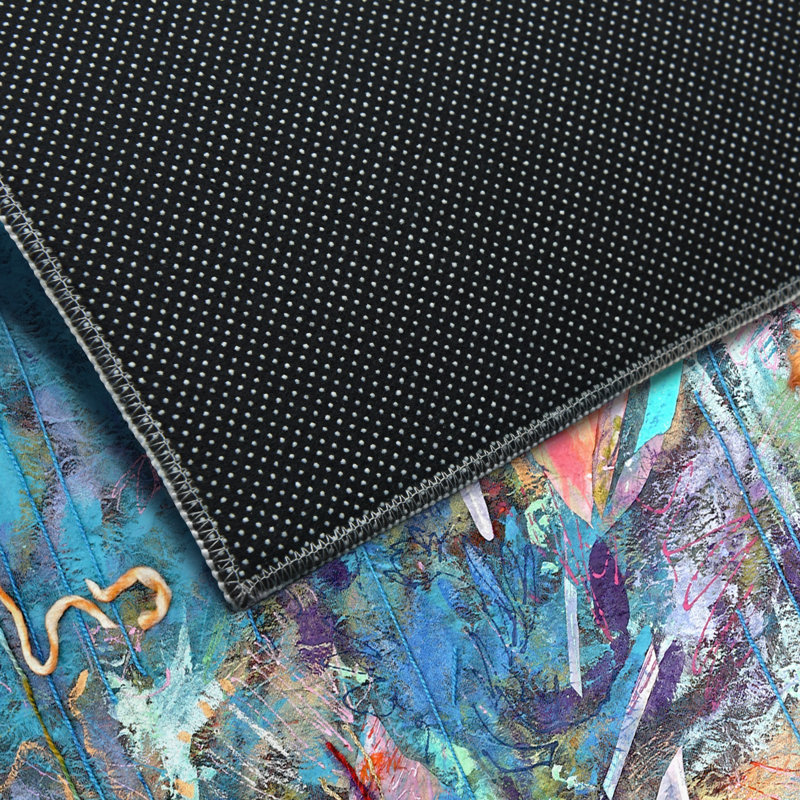 Tapis rectangulaire Divyan avec envers antidérapant
