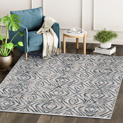 Tapis géométrique gris / noir