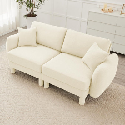 Sofa with unique shell-shaped armrests