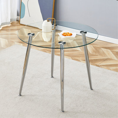 Table de salle à manger Chawki avec plateau en verre et pieds en métal