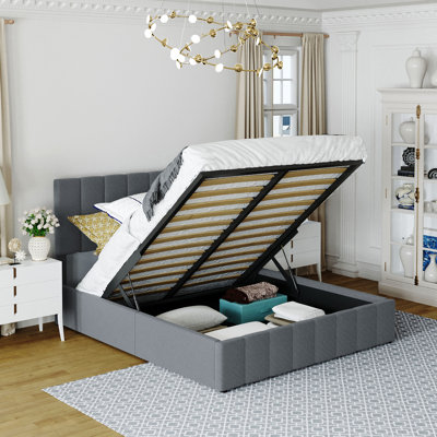 Lit plateforme tapissier avec rangement hydraulique, élégant et fonctionnel pour les chambres modernes, maximisant l'espace et le confort.