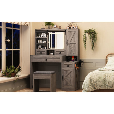 Bureau de coiffeuse avec miroir coulissant, lumières, plateau en verre et station de charge. Dans 4 tiroirs gris, 2 armoires un tabouret pour le look de chambre à coucher contemporain