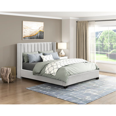 Paola Upholstered Wingback Bed