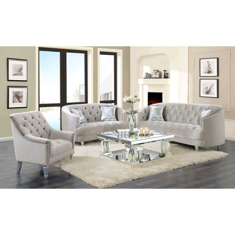 Causeuse grise grise contemporaine avec capitonnage