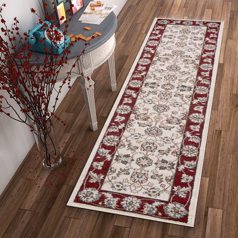 Tapis d'intérieur ivoire à bordure rouge