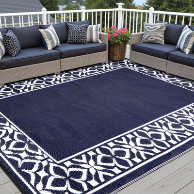 Tapis d'extérieur marocain à bordure florale bleue