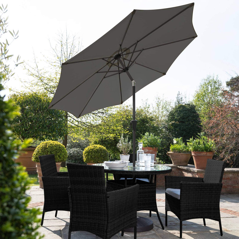 Dubose 4 - Person Wicker Patio Dining Set with Round Table , Cushions Included, Black, Yes