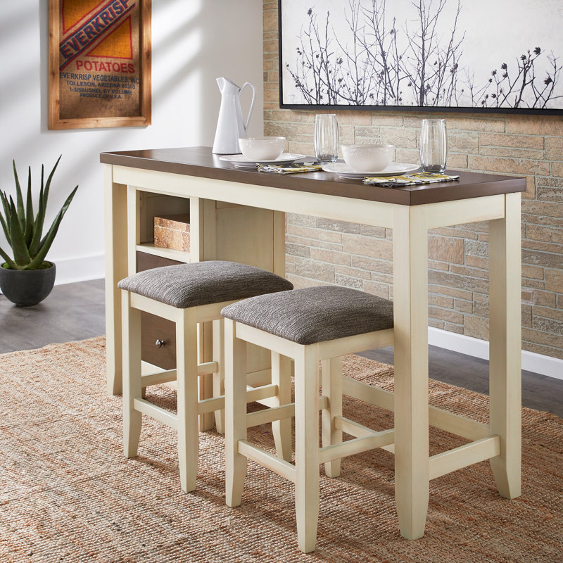 Ensemble de salle à manger à hauteur de comptoir à deux tons Madalina - table, unité de rangement et 2 tabourets. Finition crème et blanc cassé
