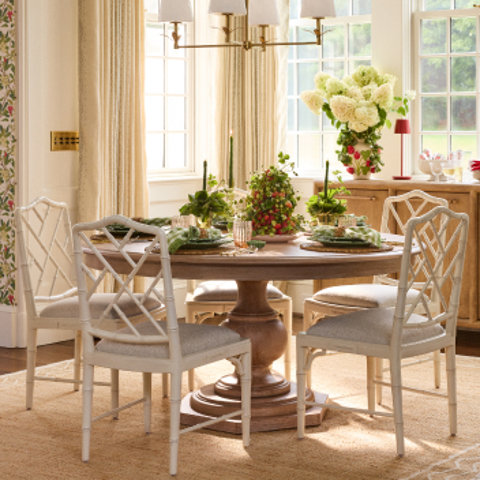 Round dining table with four chairs.