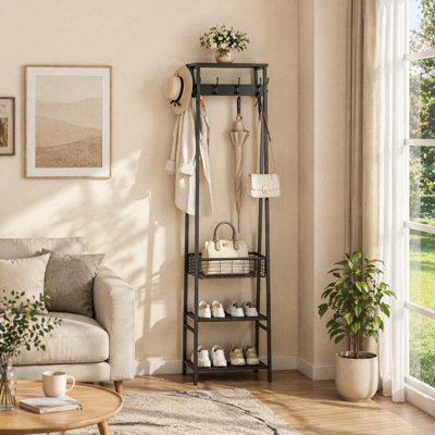 Portemanteau sur pied noir à usage domestique avec 7 crochets, panier en métal et tablette de rangement Style minimaliste pour organiser les vêtements et les sacs.
