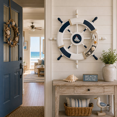Décoration murale roue de bateau avec décor de voilier et résille