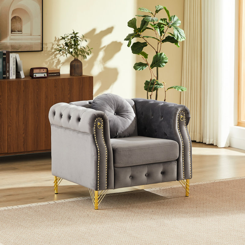 Canapé Chesterfield en velours avec coussins ronds