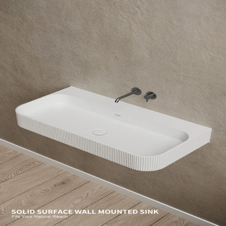 White fluted wall-mounted solid surface bathroom sink with a matte black wall-mounted faucet, Solid Surface Wall Mounted Sink Fits Your Natural Reach.