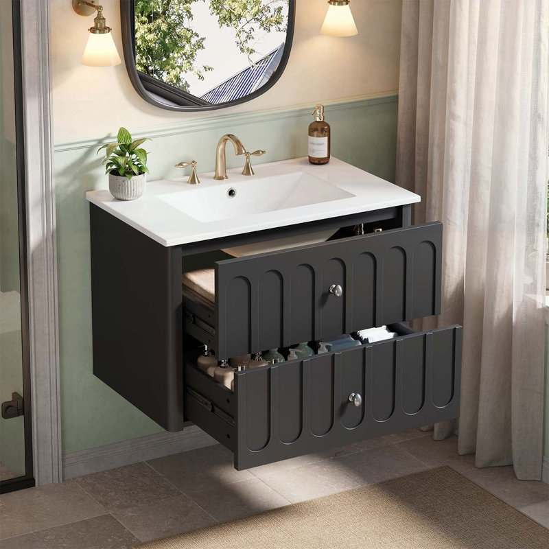 Armoire de salle de bain avec lavabo en céramique, tiroirs à fermeture en douceur et élégants boutons ovales pour les espaces compacts