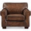 Fauteuil Capri en cuir pleine fleur ciré, dossier capitonné et garniture cloutée