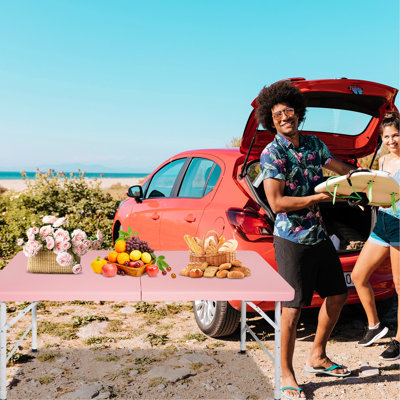 Portable Pink Folding Table 4ft. For Camping And Outdoor Enjoyment. 135kg Max Weight Support. Foldable With Fixed Grip For Effortless Handling. Smooth, Waterproof Tabletop. Triangular Design Ensures