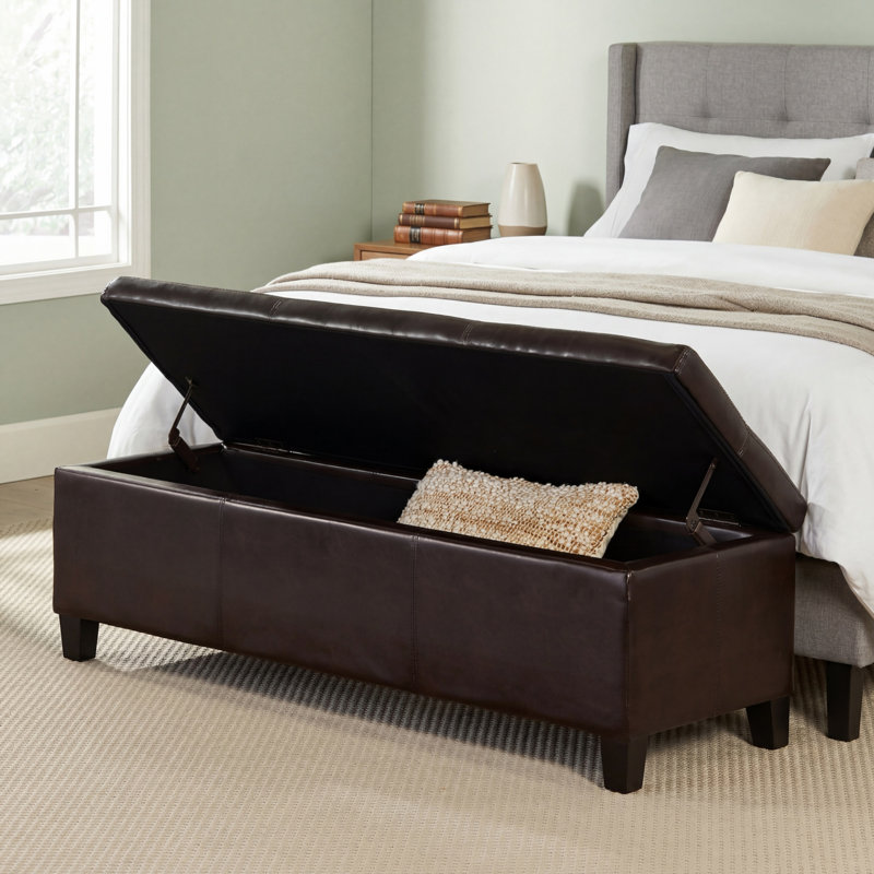 Repose-pieds brun en similicuir avec pieds en bois massif et rembourrage épais et doux Design moderne de surpiqûres; Rangement multifonctionnel à fermeture en douceur; Nécessite un assemblage simple.