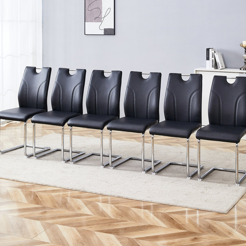 Chaise de salle à manger Black Pu (6 pièces) - Améliorez votre expérience. Surface douce, rembourrage en éponge épaisse. Forme ergonomique. Pieds argentés modernes. Fonction de glissement. Capacité de charge élevée. Installation facile de 6