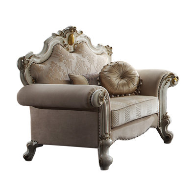 Fauteuil capitonné large Mariel