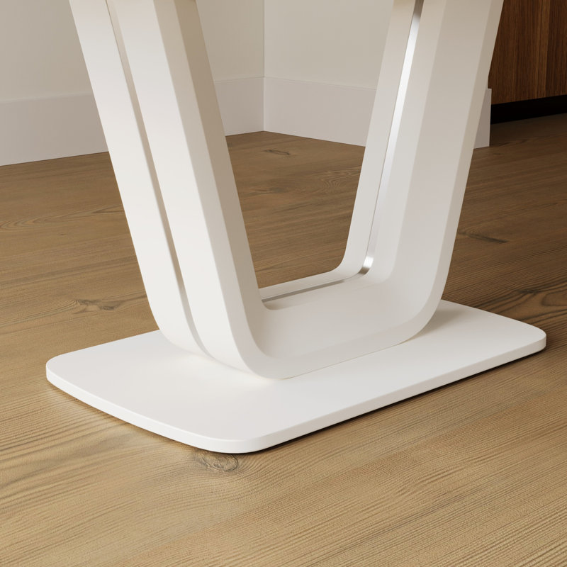 Table de salle à manger blanche extensible avec pieds robustes en forme de U pour une polyvalence élégante
